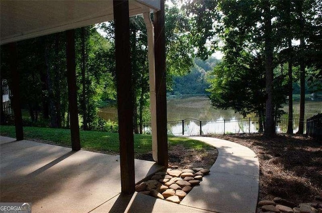 view of patio / terrace with a water view