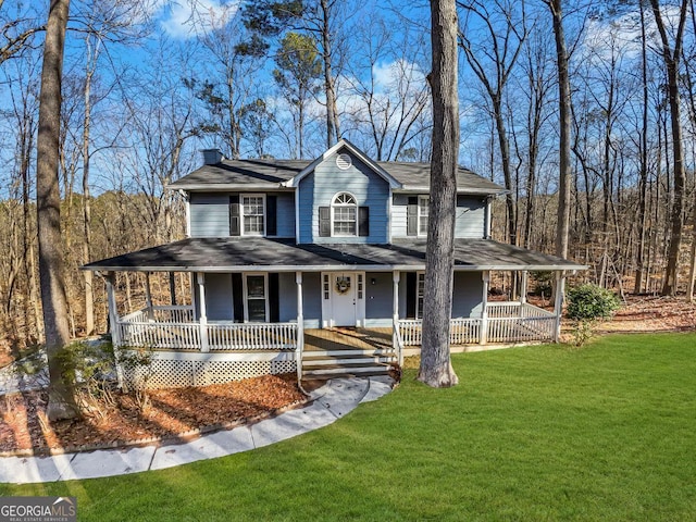 farmhouse inspired home with covered porch and a front lawn