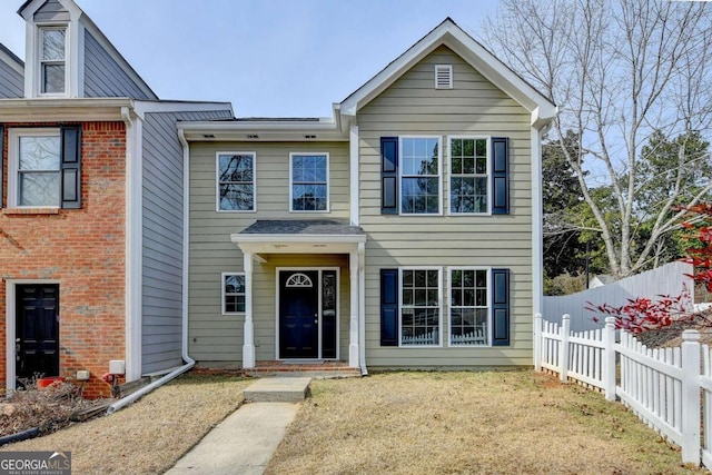 view of front of home with a front lawn