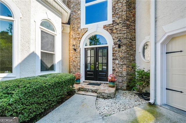 property entrance featuring french doors