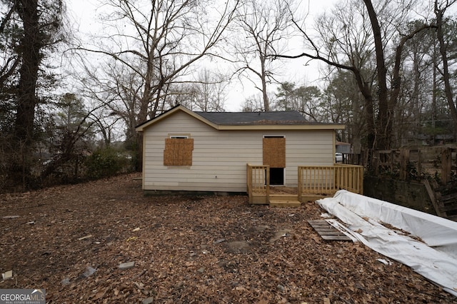 view of front of property with a wooden deck