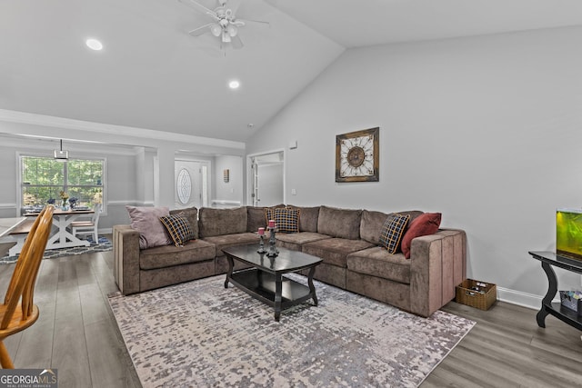 living room with ceiling fan, high vaulted ceiling, and hardwood / wood-style floors