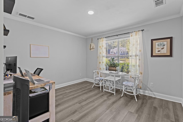 office featuring hardwood / wood-style flooring and crown molding