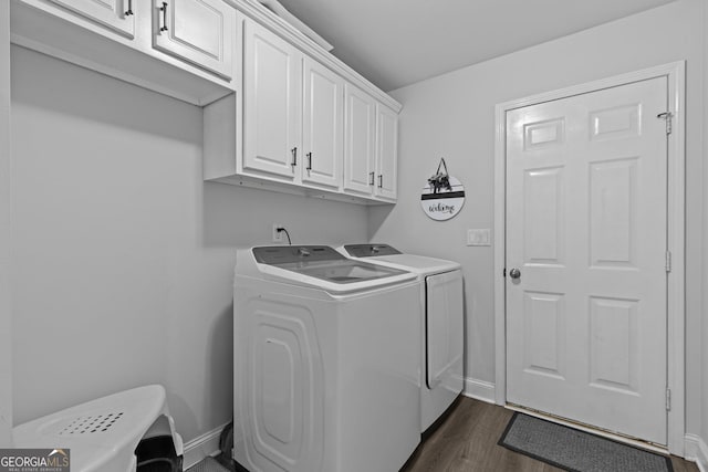 laundry area with cabinets, dark wood-type flooring, and independent washer and dryer