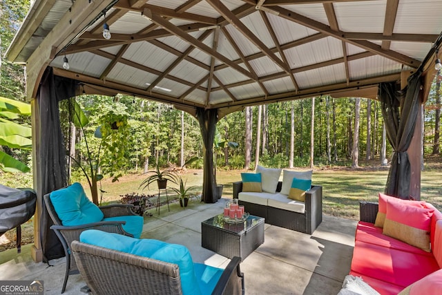 view of patio featuring an outdoor living space and a gazebo