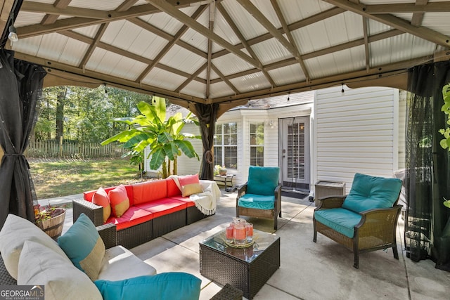 view of patio with an outdoor living space and a gazebo