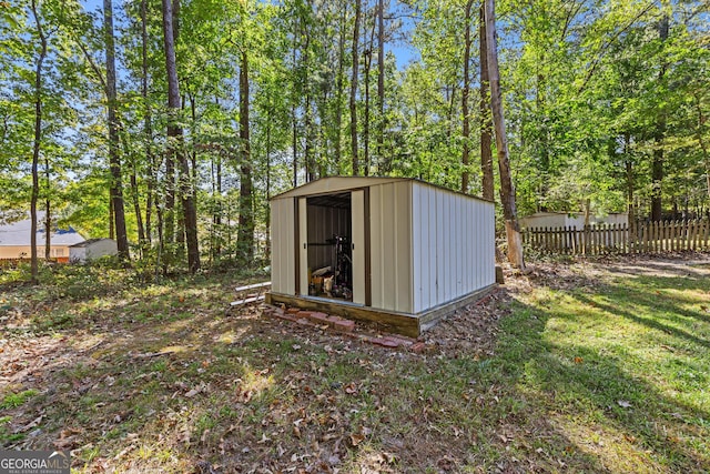 view of outdoor structure with a lawn