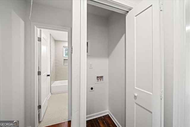 laundry room with dark hardwood / wood-style floors, hookup for an electric dryer, and hookup for a washing machine