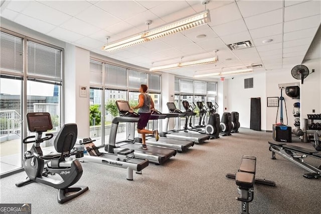 gym featuring a paneled ceiling