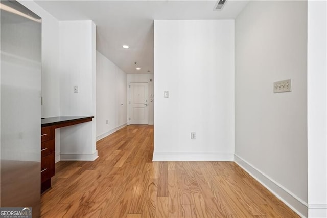 empty room with light hardwood / wood-style floors