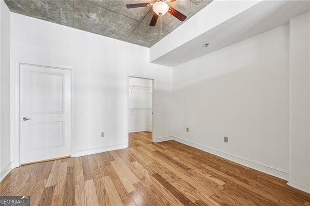 unfurnished room featuring ceiling fan and light wood-type flooring