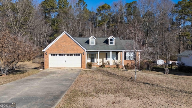 new england style home with a garage and covered porch