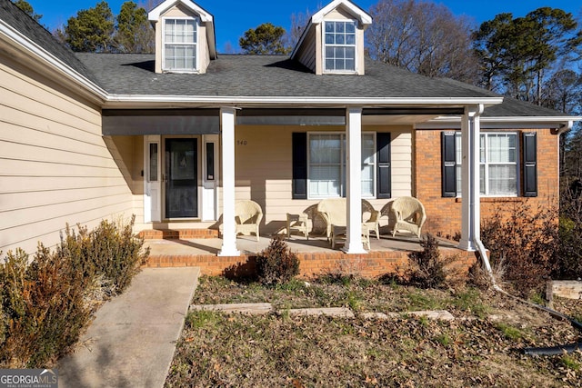 doorway to property featuring covered porch