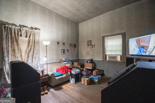 interior space with cooling unit and hardwood / wood-style floors