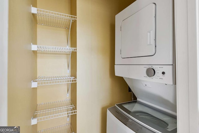 laundry room featuring stacked washer and clothes dryer