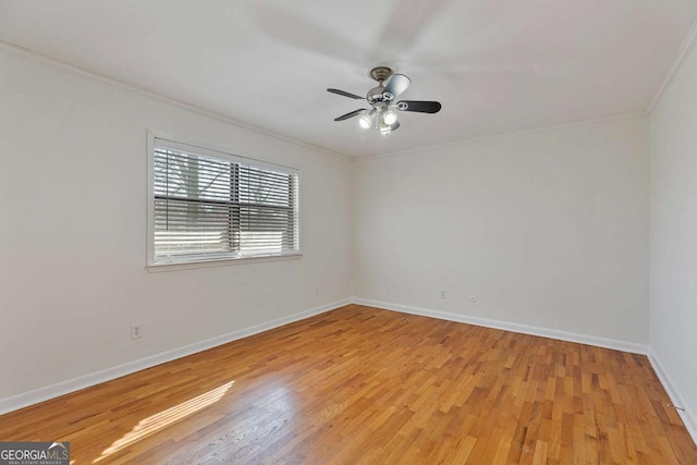 empty room featuring ceiling fan, ornamental molding, and light hardwood / wood-style floors