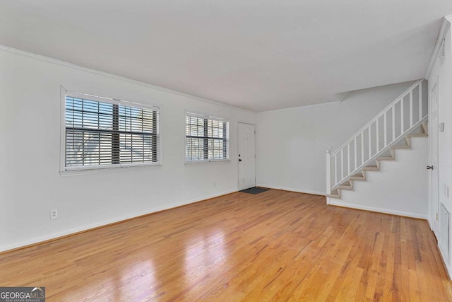 empty room with light hardwood / wood-style floors