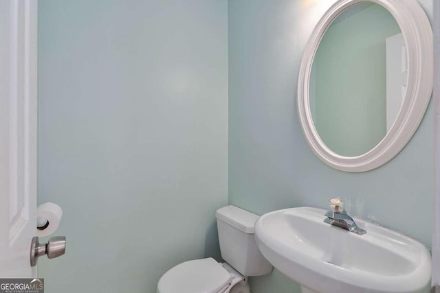 bathroom featuring sink and toilet