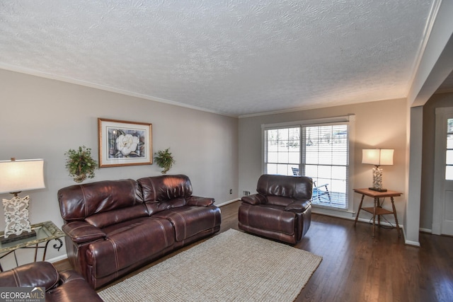 living area with ornamental molding, dark wood-type flooring, a textured ceiling, and baseboards