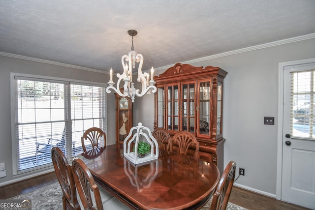 dining room featuring ornamental molding, dark wood-style flooring, and a notable chandelier