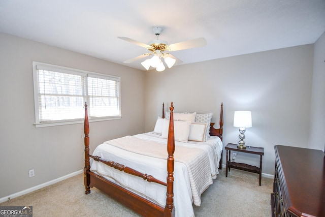 carpeted bedroom with baseboards and a ceiling fan