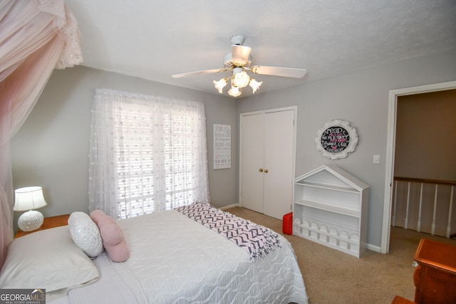 bedroom with carpet floors, a closet, and ceiling fan