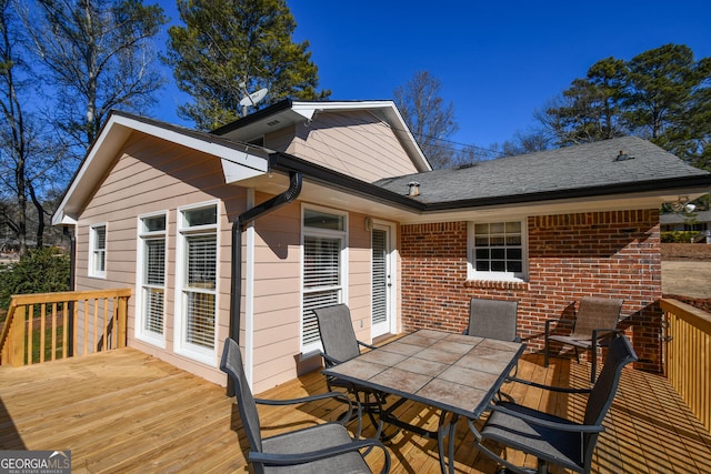 deck with outdoor dining area