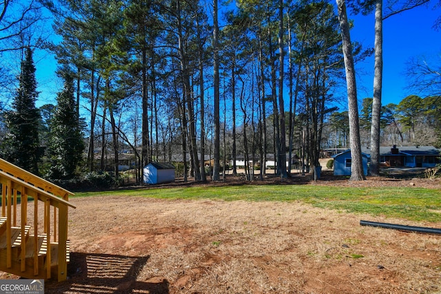 view of yard with a storage unit and an outdoor structure