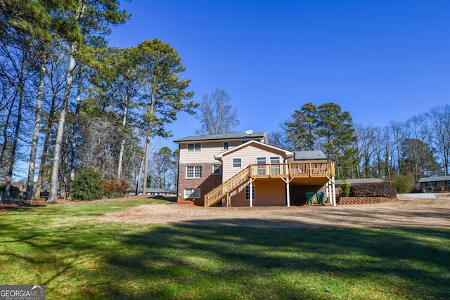 rear view of property featuring a lawn, a wooden deck, and stairs