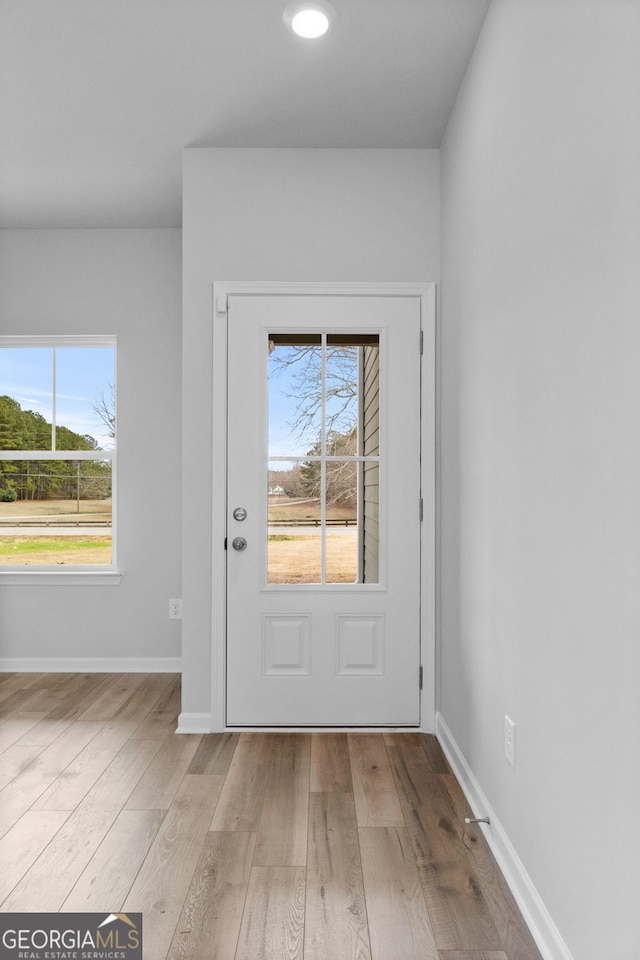 doorway to outside featuring light hardwood / wood-style floors