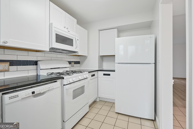 kitchen with white cabinetry, white appliances, and backsplash