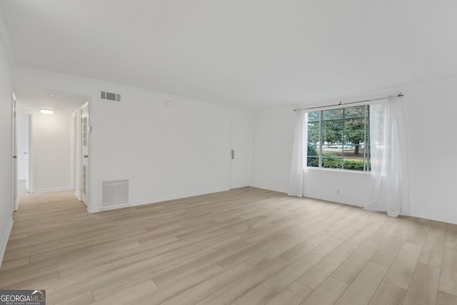 unfurnished room with light hardwood / wood-style flooring