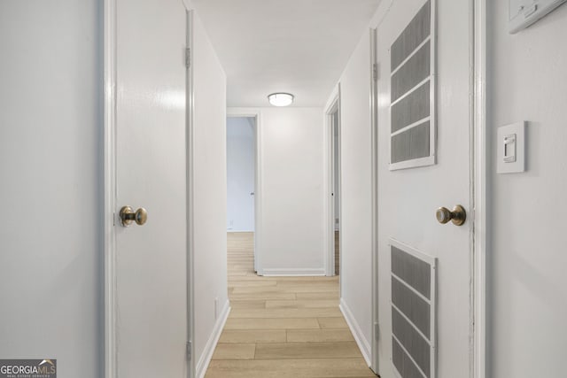 hallway featuring light hardwood / wood-style flooring