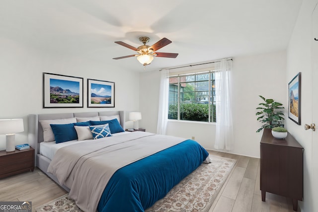 bedroom featuring light hardwood / wood-style flooring and ceiling fan