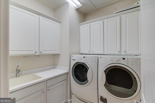 6706 Amherst Dr, Hoschton, GA 30548 - washroom with cabinet space and washer and clothes dryer
