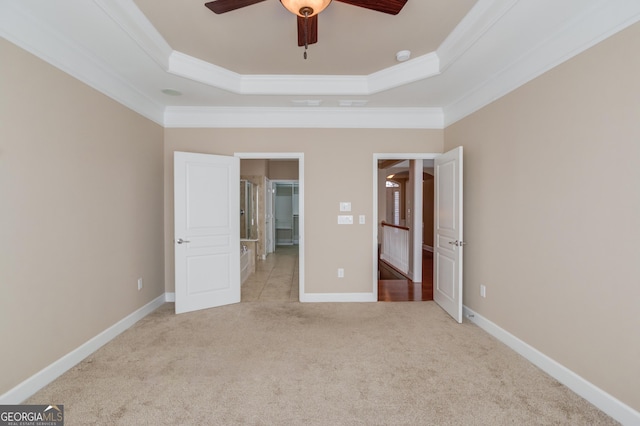 6706 Amherst Dr, Hoschton, GA 30548 - unfurnished bedroom with a raised ceiling, carpet, crown molding, and a ceiling fan