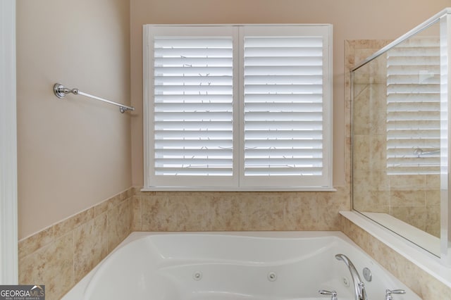 bathroom featuring a washtub