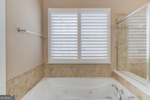 6706 Amherst Dr, Hoschton, GA 30548 - bathroom featuring a tub with jets