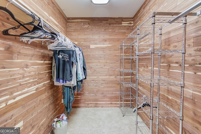 walk in closet with carpet flooring