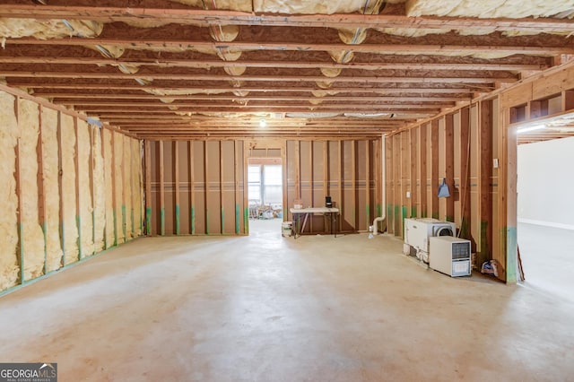 misc room with concrete flooring