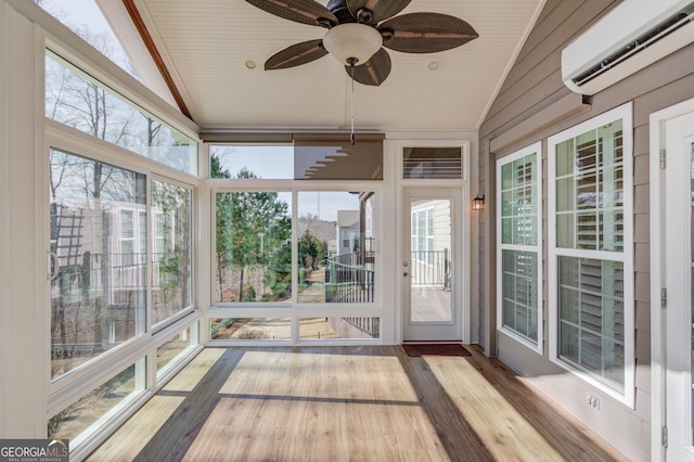 unfurnished sunroom with vaulted ceiling, a wall mounted AC, and ceiling fan