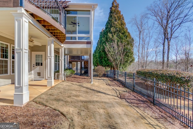 exterior space with ceiling fan