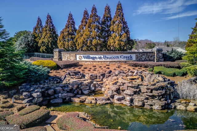 6706 Amherst Dr, Hoschton, GA 30548 - community / neighborhood sign featuring a garden pond