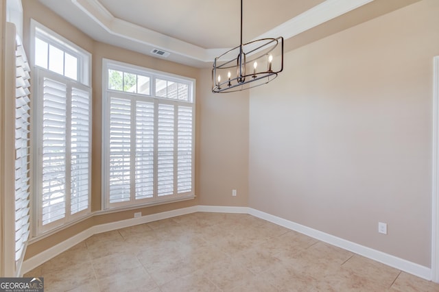 6706 Amherst Dr, Hoschton, GA 30548 - unfurnished dining area with a chandelier, tile patterned floors, and a tray ceiling