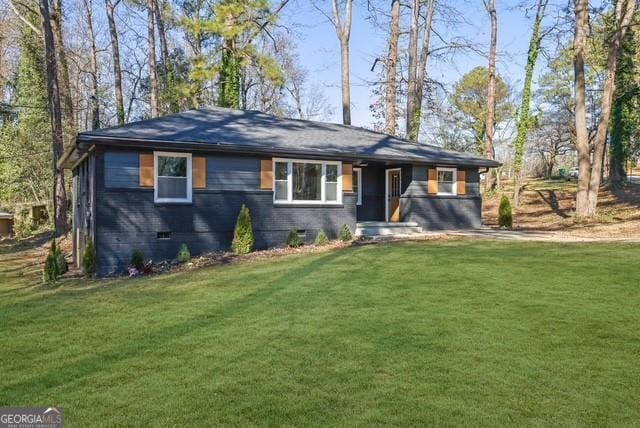 ranch-style house featuring a front lawn