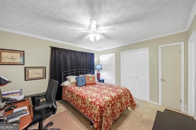 carpeted bedroom with ceiling fan, ornamental molding, and a textured ceiling