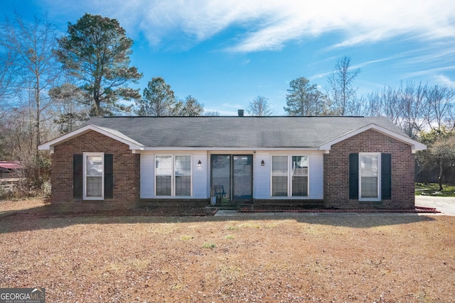 ranch-style house with a front lawn