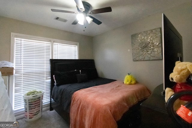 carpeted bedroom with ceiling fan