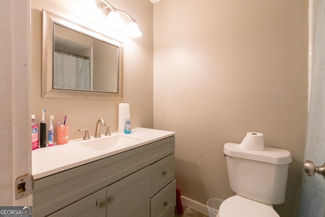 bathroom with vanity and toilet