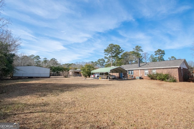 view of yard with a carport